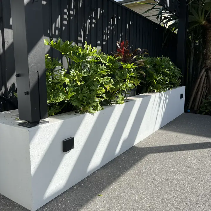 Planter boxes trimmed back to a clean line, Golden Beach