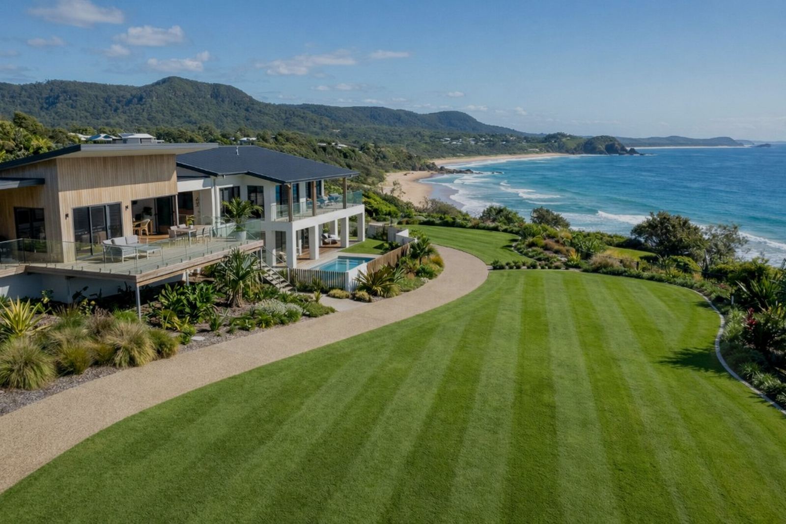 Coastal Sunshine Coast home with manicured lawn — T-Squared lawn and garden care